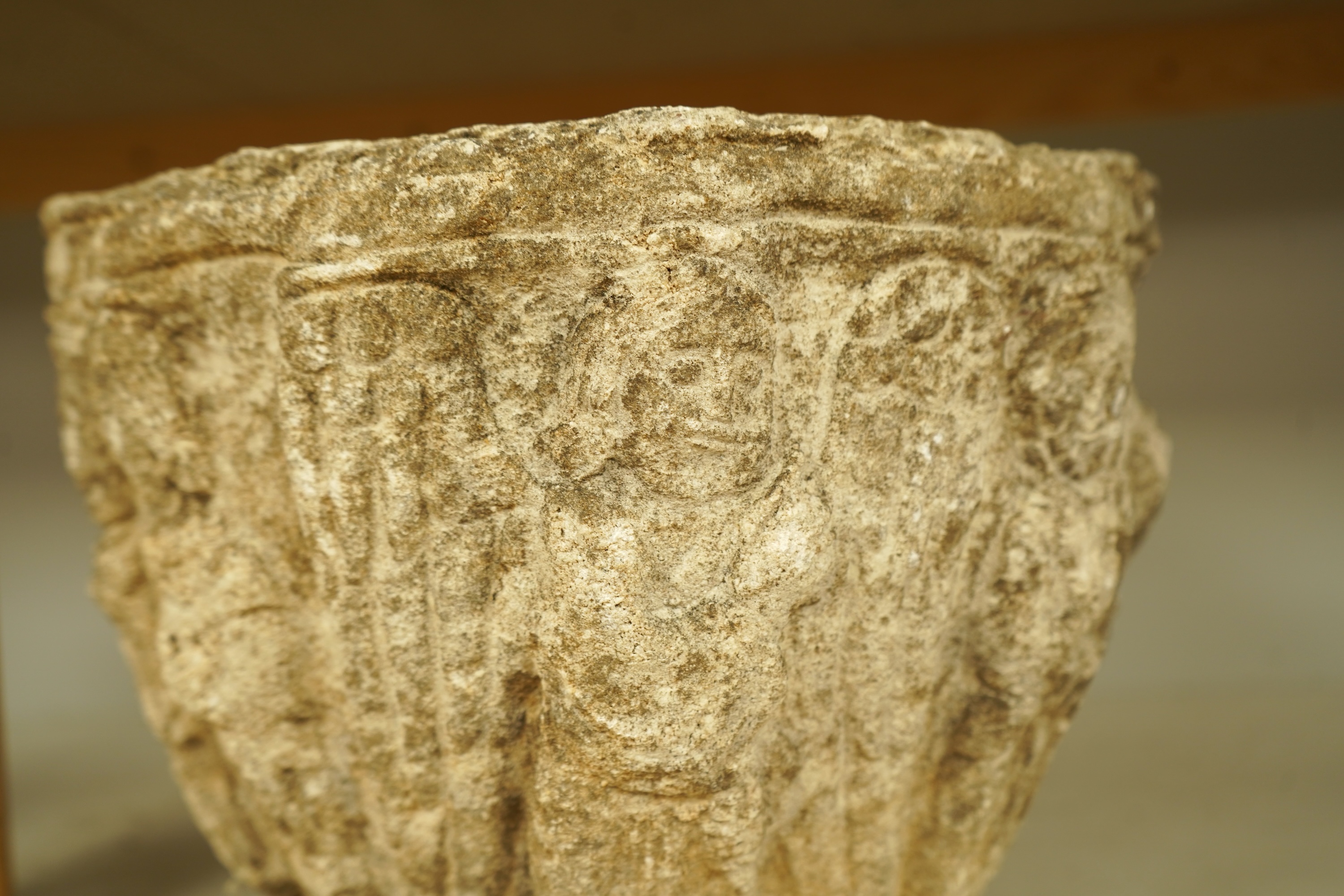A Romanesque style reconstituted stone planter, 31cm in diameter
